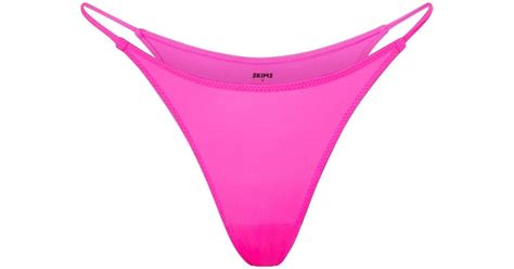 skims pink bikini.